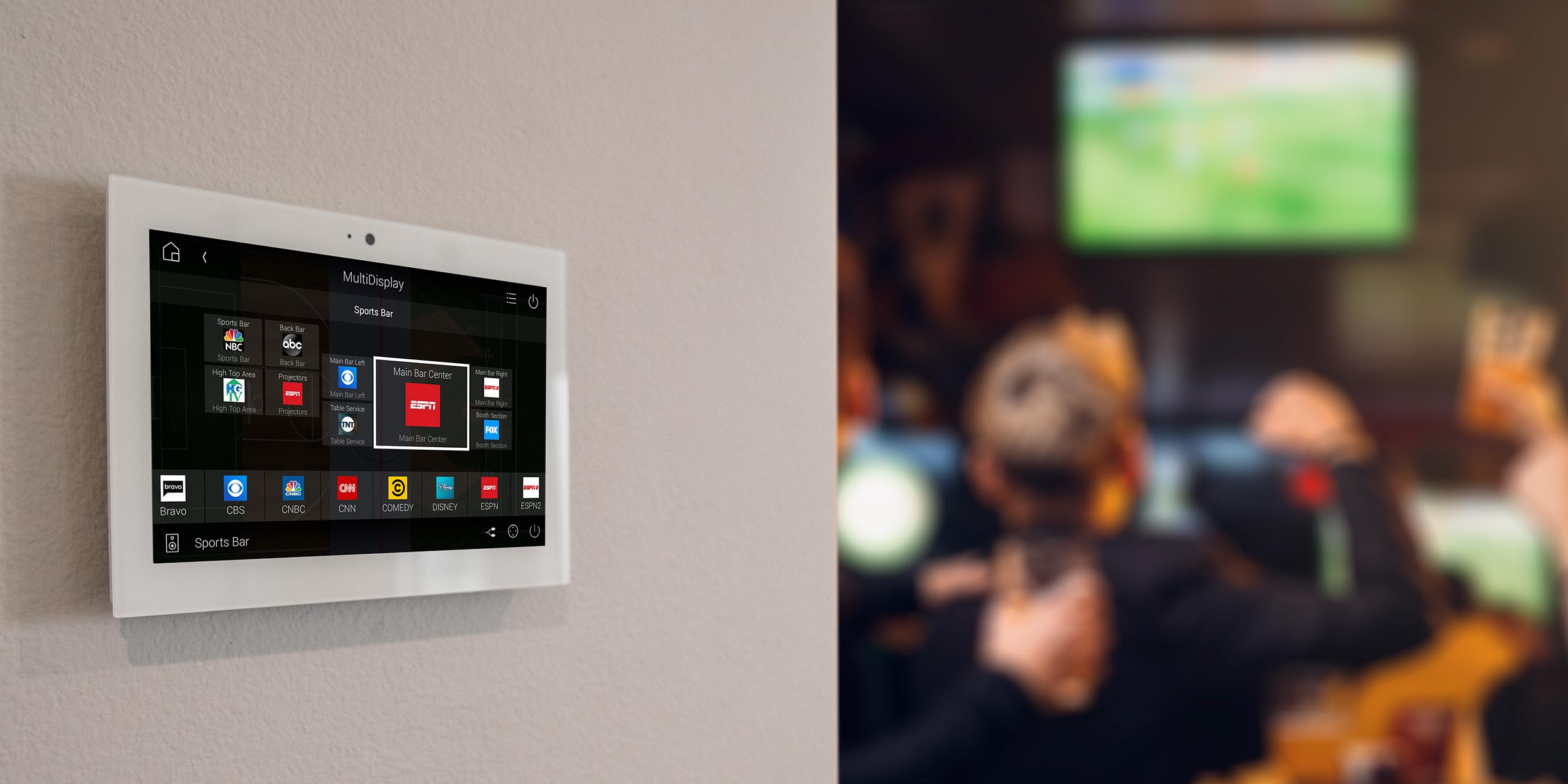 Touchscreen display in sports bar showing multi-display setup