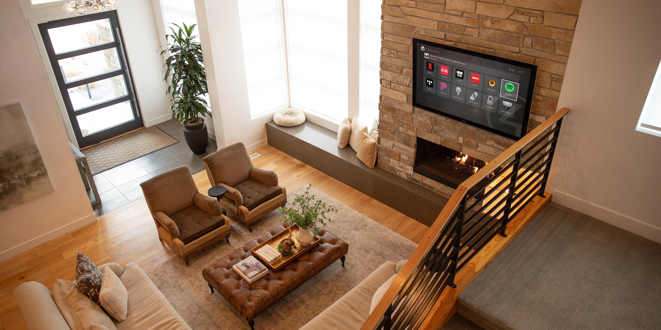 Bright living room with wall-mounted smart TV and elegant furnishings
